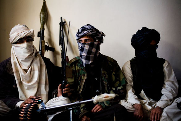 Qomendan Hemmet a Taliban commander sits with his lieutenants