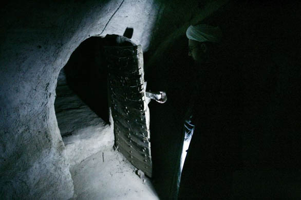 Shiite cleric Sheikh Ahmed Kashef al-Ghataa shows an ancient underground tunnel under his house