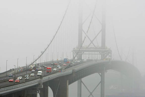 Motorists start to travel toll-free across the Forth Bridge over the Firth of Forth