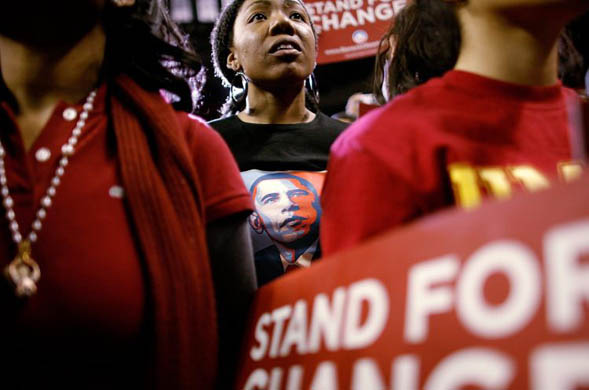 Supporters of Barack Obama listen to him address a campaign rally