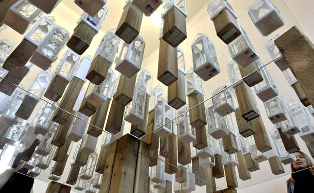 A woman looks at an art piece by Anna Stoecker at the Staatliche Kunstakademie