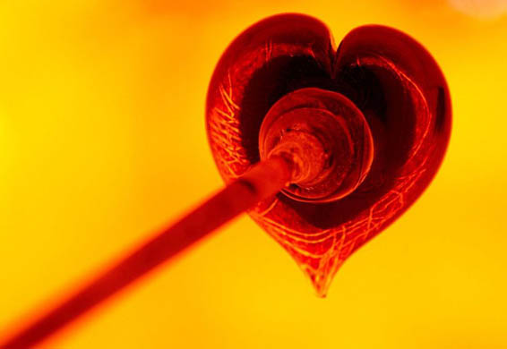 Glassblower John Ditchfield creates a heart shaped glass paperweight at his studios