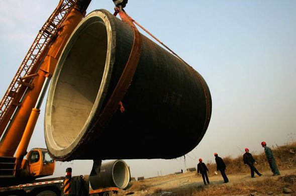 Beijing, China: Labourers work at the construction site of a water diversion project