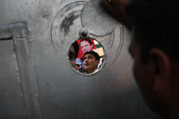 Lahore, Pakistan: Supporters of Nawaz Sharif stand outside his home