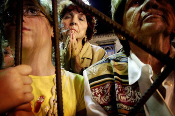 Havana, Cuba: People attend a mass given by Cardinal Tarcisio Bertone