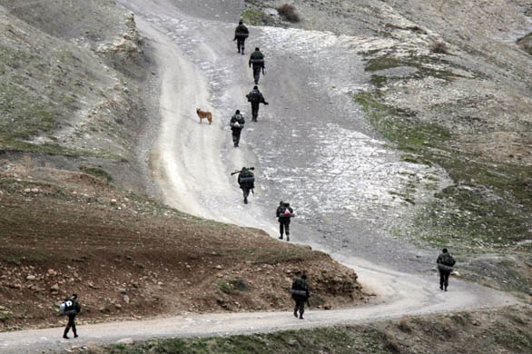 Turkish commandos walk on a mountain