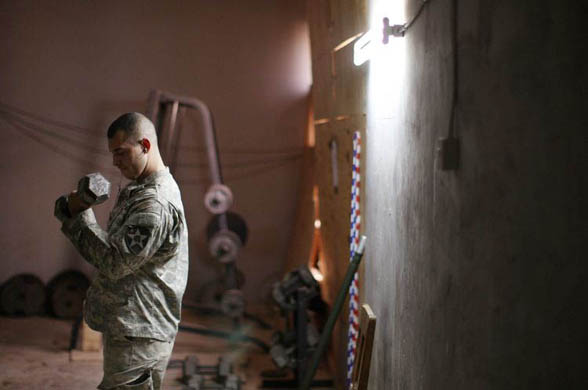Diyala Province, Iraq: Spc. Frank Cortez, with the Army 2-1 Cavalry, lifts weights