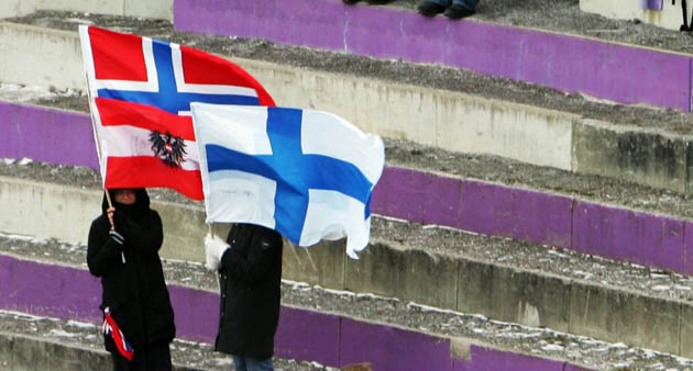 Supporters wait for the start of the third round of the FIS Ski Jumping World Cup event