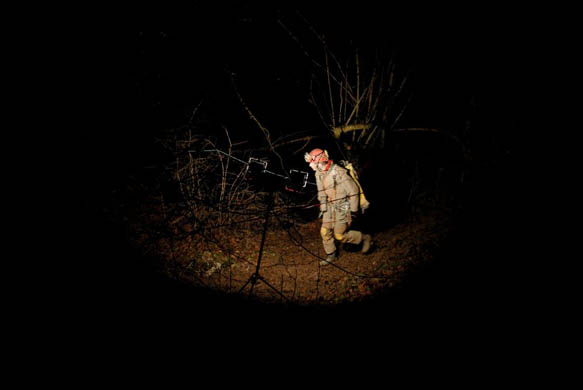 A man gets ready before going down inside the Biefs Boussets cave in a bid to rescue six fellow speleologists