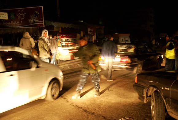 Palestinian policemen try to organise traffic in Gaza