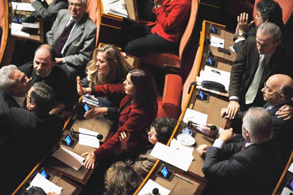 Italian Catholic UDEUR senator Tommaso Barbato is stopped by colleagues