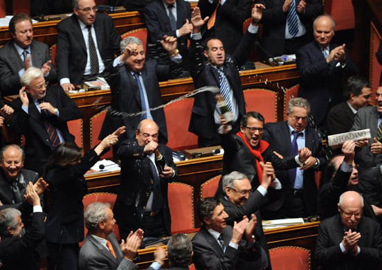 Centre-right senators celebrate after the confidence vote in Romano Prodi