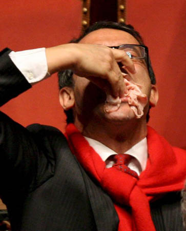 Senator Nino Strano eats mortadella to celebrate the end of Romano Prodi's government