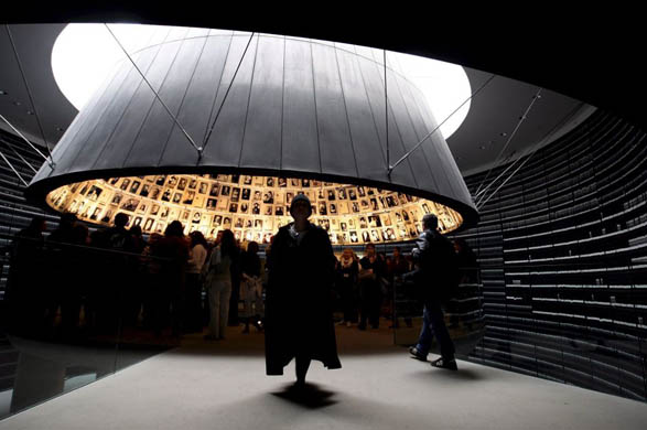 Visitors view the conical-shaped 'Hall of names' in the Yad Vashem Holocaust Memorial museum during International Holocaust Remembrance Day