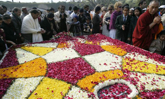 People pay floral tribute at the memorial of Mahatma Gandhi