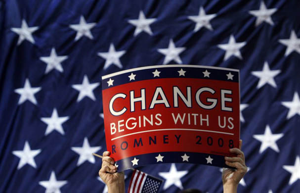 A supporter holds up a sign during a Florida primary day campaign rally for Mitt Romney