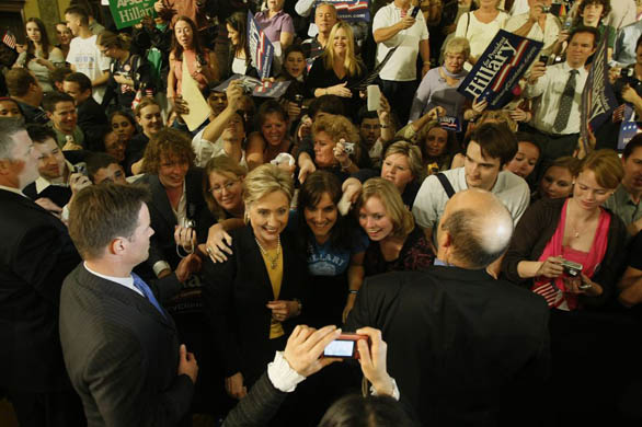 Hillary Clinton poses for a photograph with supporters after winning the Florida primary