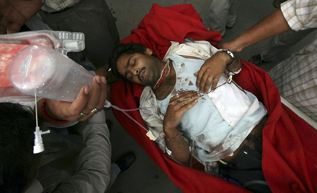 Jammu, India: A victim is rushed to a hospital after a grenade exploded during a protest rally