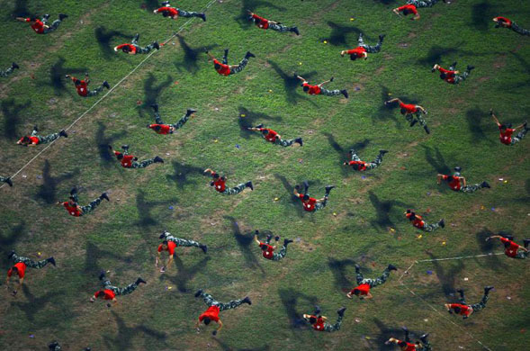 Chongqing, China: Paramilitary policemen display their skills during an anti-terror drill