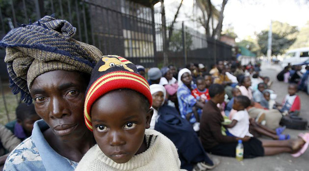 Harare, Zimbabwe: Some of the 200 people sitting outside the US Embassy who are reportedly victims of violence stemming from the elections