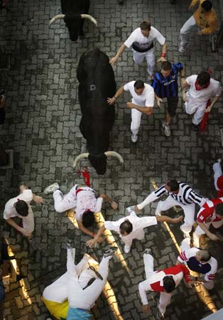 Revelers chased by bulls