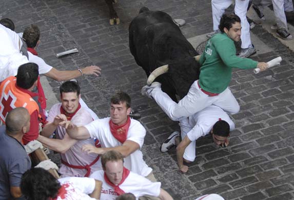 Participants run ahead of the bulls