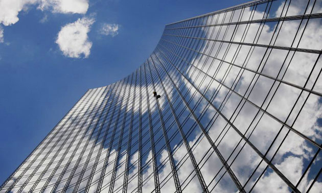 Alain Robert climbs the Skyper building 