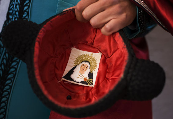 Pamplona, Spain: A matador's hat or montera decorated with an image of the Virgin. The town's annual San Fermin festival attracts tens of thousands of visitors for nine days of revelry. Photograph: Daniel Ochoa de Olza/AP