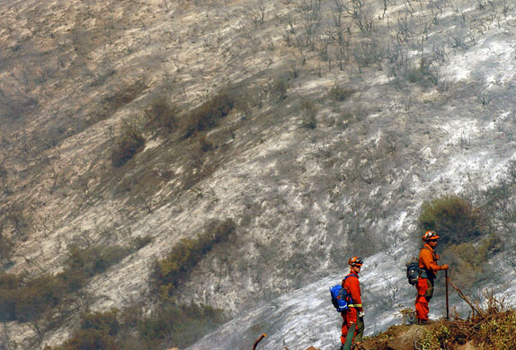 California, US: Firefighters keep a look out along  West Camino Cielo; homes in southern Santa Barbara county are still threatened by a fire in the Los Padres National Forest. Photograph: Mike Eliason/Santa Barbara News-Press/AP
