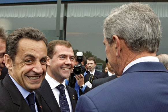 Hokkaido, Japan: The French and Russian presidents Nicolas Sarkozy (l) and  Dmitry Medvedev smile as they meet George W Bush before the G8 summit. Photograph: Dmitry Astakhov/EPA/Pool