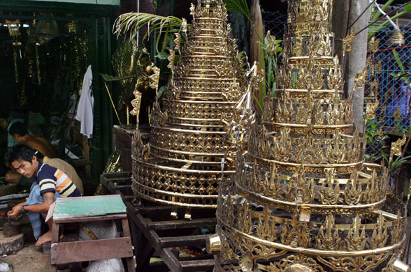 Rangoon, Burma: Two newly made stupas, brass structures placed on the top of pagodas, on display in a workshop. Photograph: AP