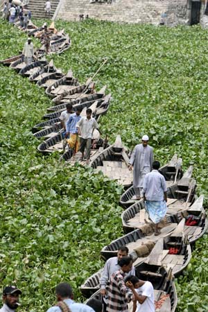 makeshift bridge built by joining boats
