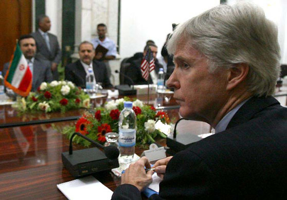 May 28 2007, Baghdad, Iraq: US ambassador to Iraq Ryan Crocker and his Iranian counterpart Hassan Kazemi Qomi, left, attend a meeting on security in Iraq