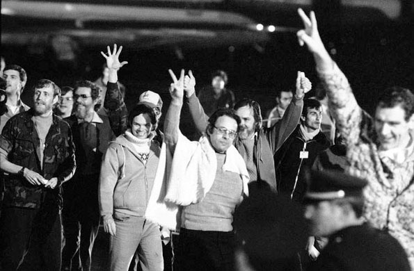 January 21 1981, Algiers: A group of hostages give the victory sign as they emerge from an Algerian aircraft after their flight from Tehran