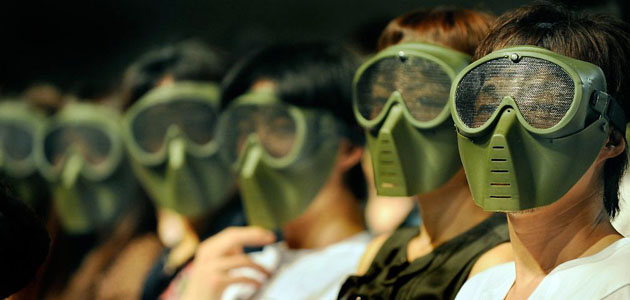 Tokyo, Japan: People wear replicas of gas masks during the premiere of the movie 'The Happening'