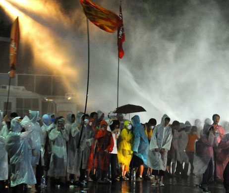 Seoul, South Korea: Riot police blast water at radical anti-goverment protesters