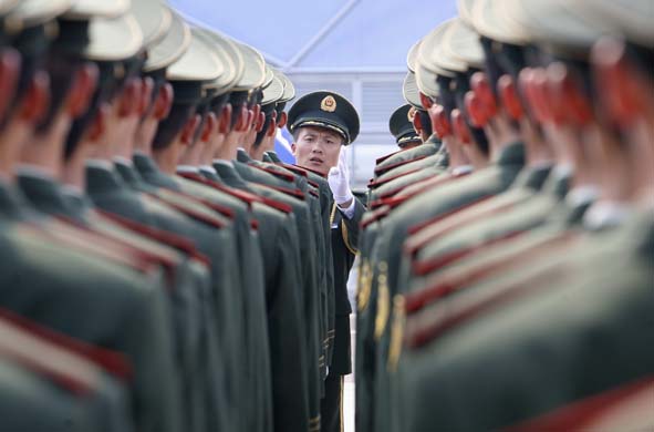 Paramilitary policemen stand in line Beijing