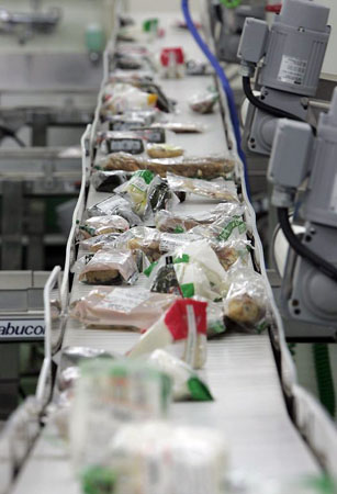 Sakura, Japan: Food waste from convenience stores at Agri Gaia System, a waste food recycling company