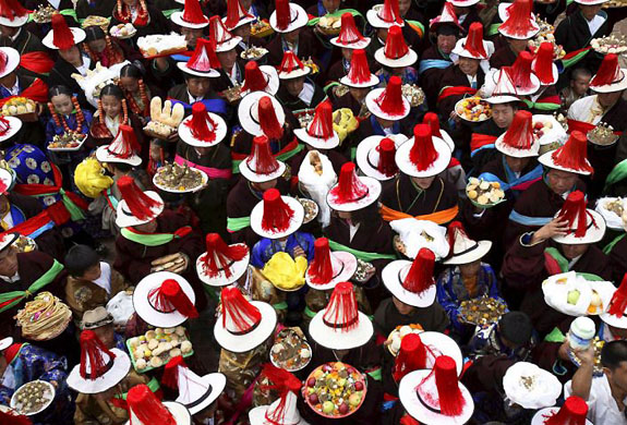 Tongren County, China: Local Tibetans perform a ritual dance for a mountain spirit during the June-Song-Dance festival