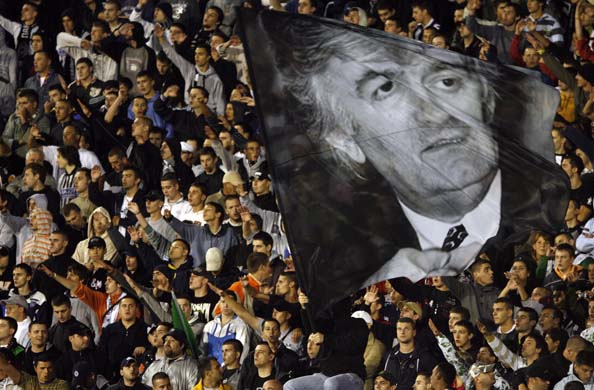 fans wave a picture of Radovan Karadzic