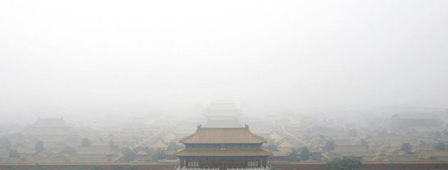 Beijing, China: An aerial view of the Forbidden City shrouded in haze