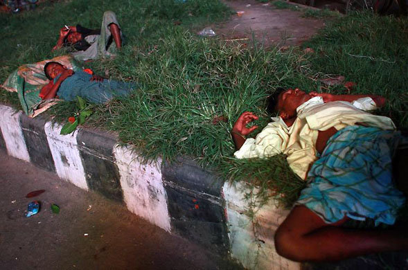 Dhaka, Bangladesh: Homeless people sleep on the street 