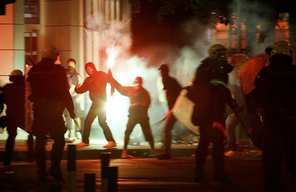 Protestors hurl stones at riot police