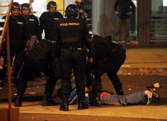 Riot police arrest protester
