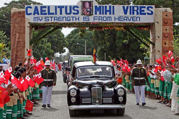 Tongan school children wave flags