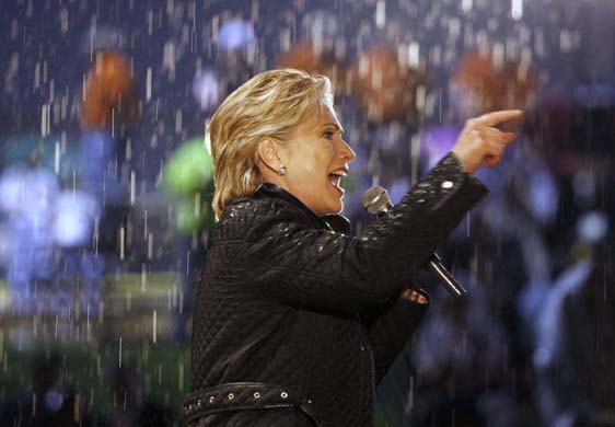 Hillary Clinton campaigns in rain
