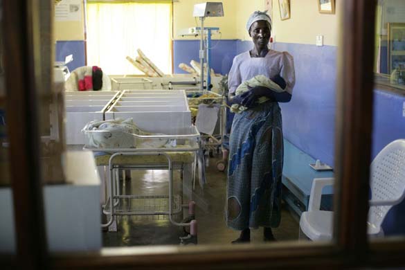 Bwali hospital Malawi Nangando Dokotara holding her baby grandaughter