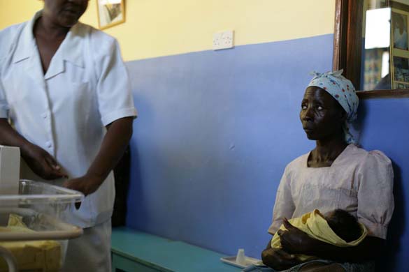 Nangando Dokotara holding her baby granddaughter at Bwalia hospital