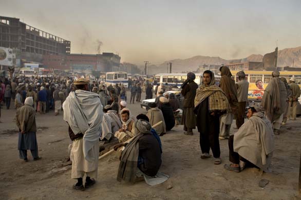 Unemployed men gather in one of Kabul's roundabouts hoping to pick up a day's work