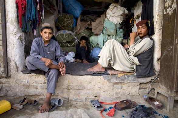 Portrait of boys who work at a clothing shop in Kandahar